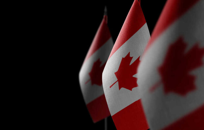 Small,National,Flags,Of,The,Canada,On,A,Black,Background