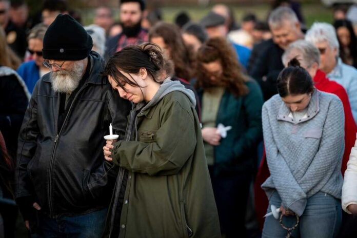 People,Pray,During,A,Community,Vigil,Held,For,The,People