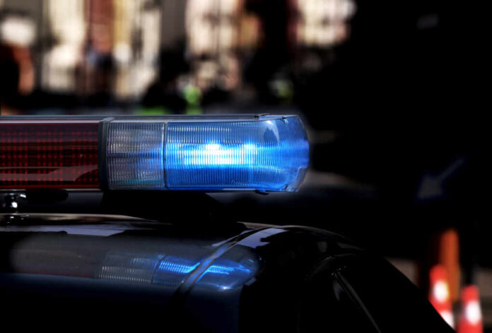 Police,Patrol,Car,With,Flashing,Lights,And,Siren,On,During