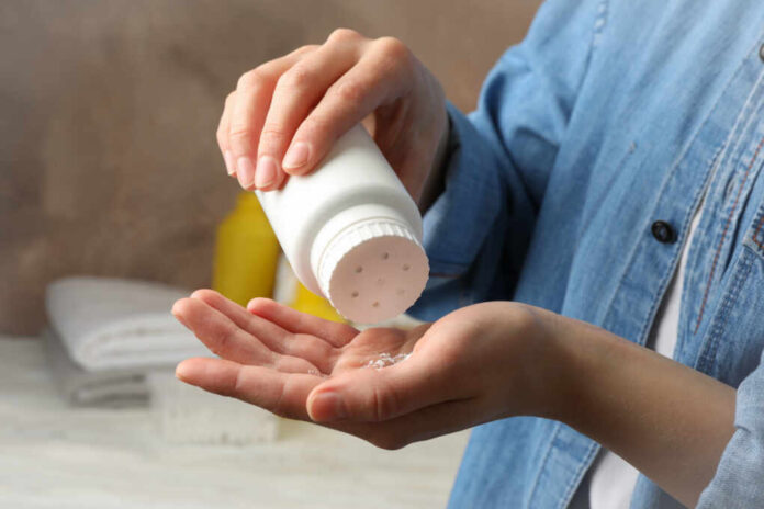 Mom,Applying,Talc,Powder,From,Plastic,Tube.,Baby,Hygiene