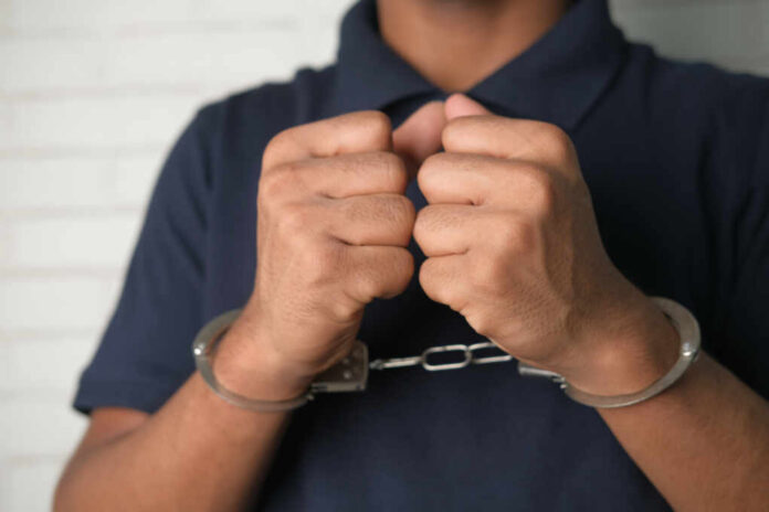 Man,In,Black,Shirt,With,Handcuff