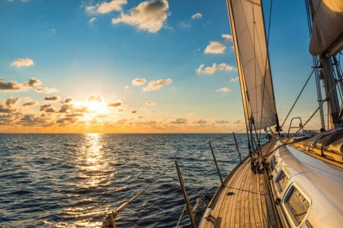 Cruising,Sailboat,Sailing,In,The,Mediterranean,Sea,At,Sunset
