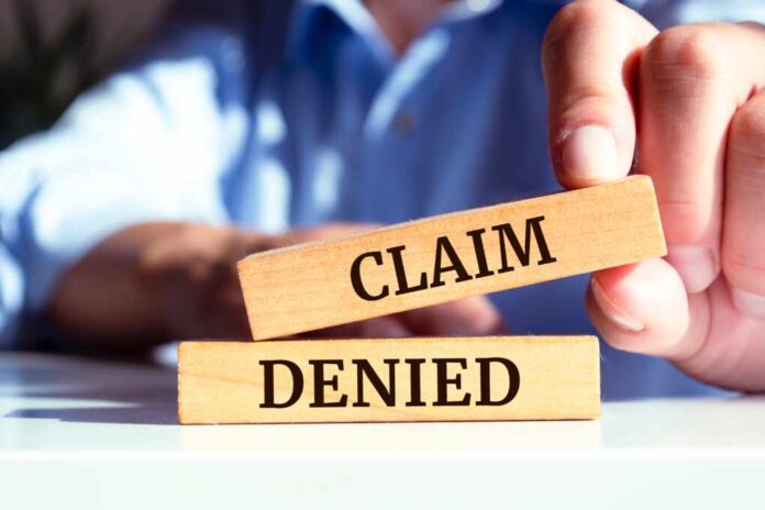 Wooden,Blocks,With,Words,'claim,Denied'.