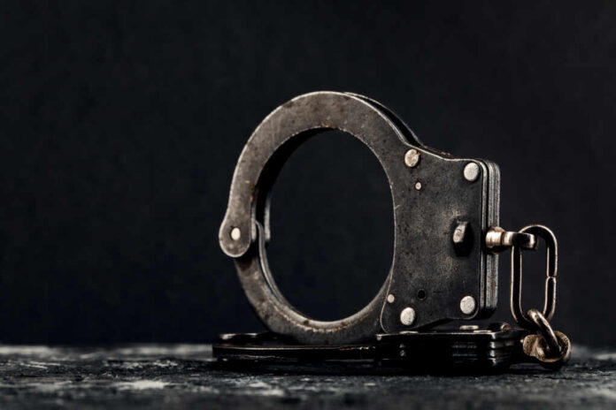 Handcuffs,On,A,Dark,Background.,The,Concept,Of,Crime,And