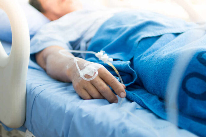 Focus,On,The,Hand,Of,A,Patient,In,Hospital,Ward