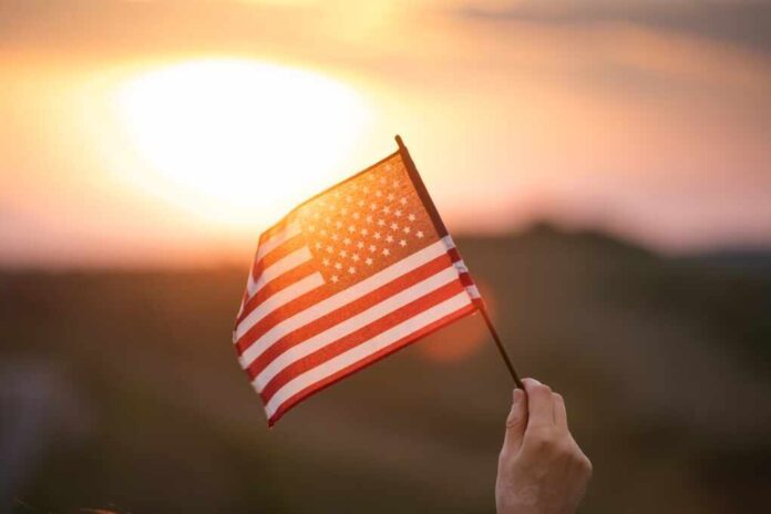 Close,Up,On,Usa,Flag,In,A,Hand,Of,A