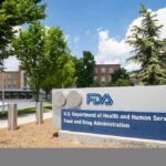 Exterior view of the FDA building with signage and trees