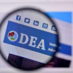 Magnified view of a website header featuring the acronym 'DEA' and social media icons