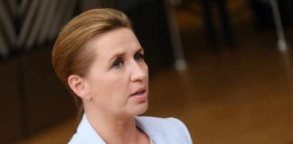 A female politician speaking at a government event