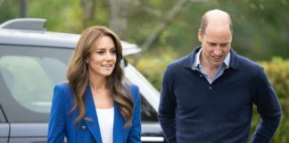 A couple walking outdoors, smiling at each other