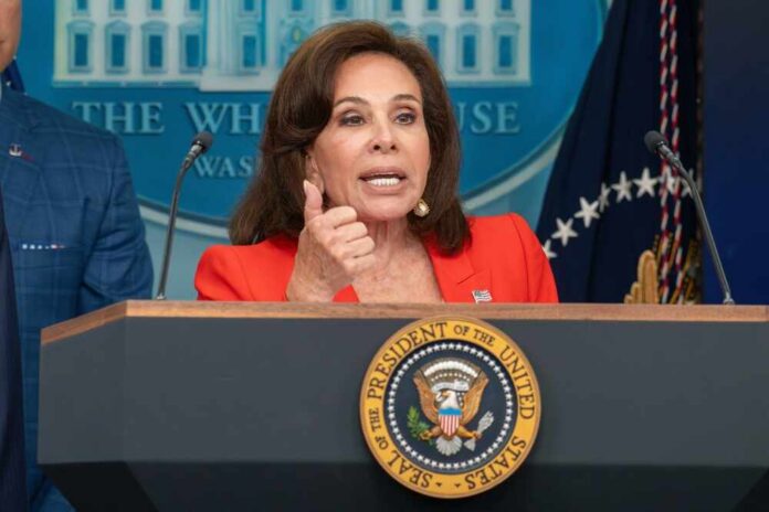 A government official speaking at a podium during a press conference