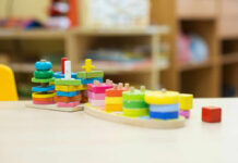 Colorful wooden stacking toys arranged on a table