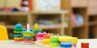 Colorful wooden stacking toys arranged on a table
