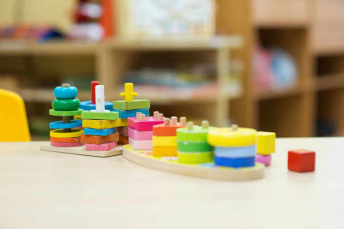 Colorful wooden stacking toys arranged on a table