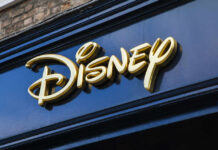 Golden Disney logo on a dark blue storefront