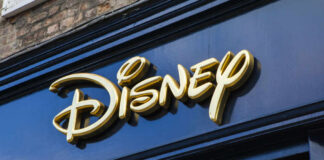 Golden Disney logo on a dark blue storefront