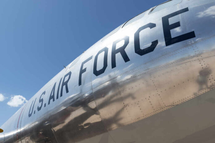 shutterstock_412493977.jpg Close-up of a U.S. Air Force aircraft with a shiny metallic surface against a blue sky