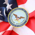 Department of Defense emblem on an American flag background