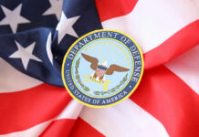 Department of Defense emblem on an American flag background