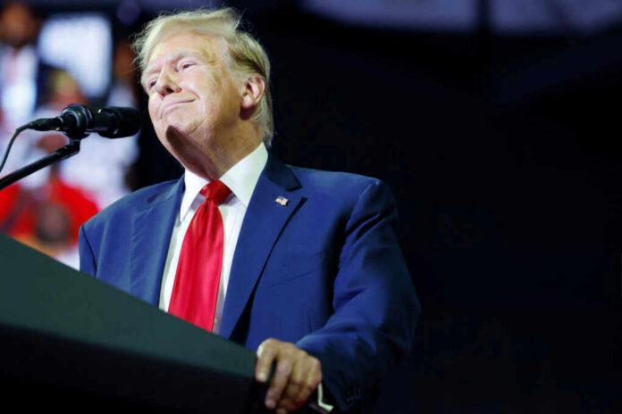 shutterstock2541639003jpg A man in a suit speaking at a podium with a microphone