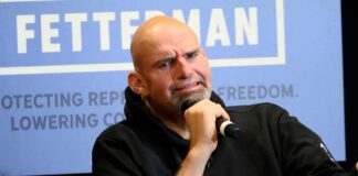 A speaker passionately discussing topics at a public event