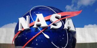 NASA logo displayed on a large blue globe against a clear sky