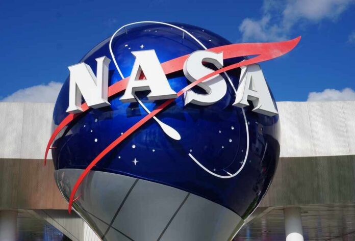 shutterstock_2607099299.jpg NASA logo displayed on a large blue globe against a clear sky