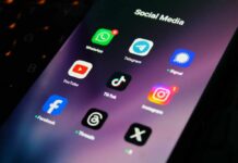 Addiction-By-Design Verdict Shocks Big Tech Close-up of a smartphone screen displaying various social media app icons