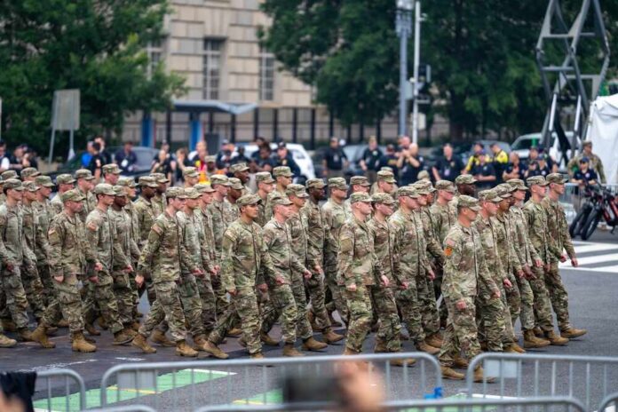 A group of soldiers in military uniforms marching in formation during a parade