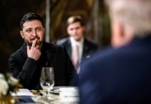 Two political leaders engaged in a serious discussion at a formal meeting