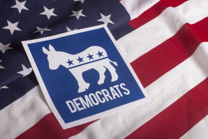 shutterstock305852246jpg Democratic Party logo featuring a donkey on an American flag background