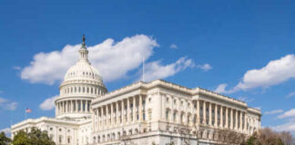 The U.S. Capitol building with a clear blue sky in the background