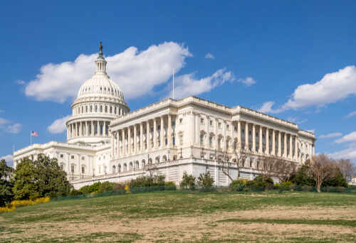 The U.S. Capitol building with a clear blue sky in the background
