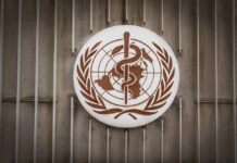 Sneaky Governance Shift: WHO’s New Global Network World Health Organization emblem featuring a globe and caduceus