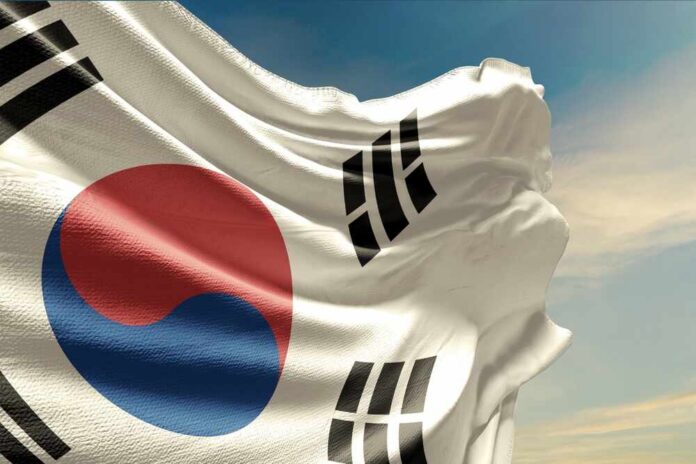 Waving flag of South Korea against a blue sky