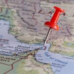 A red pushpin on a map of the Middle East highlighting a specific location