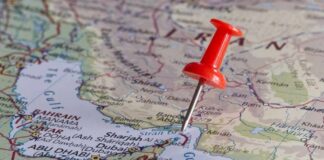 A red pushpin on a map of the Middle East highlighting a specific location