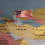 A map highlighting Iran with a small American flag pin