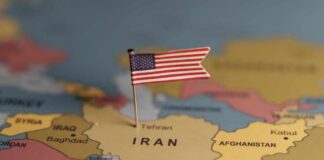 A map highlighting Iran with a small American flag pin