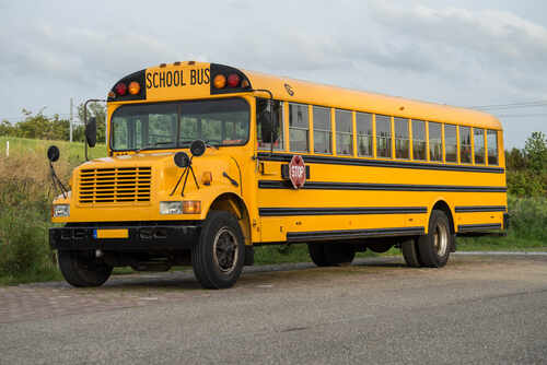 A yellow school bus parked on a road