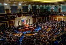Congressman’s Explosive Accusation Against Trump Admin A large gathering of officials in a congressional chamber during a legislative session