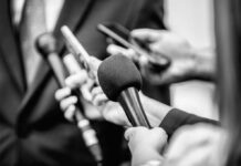 SHOCKING Report: Safety Protocols Failing Journalists Close-up of microphones held by journalists during a press conference