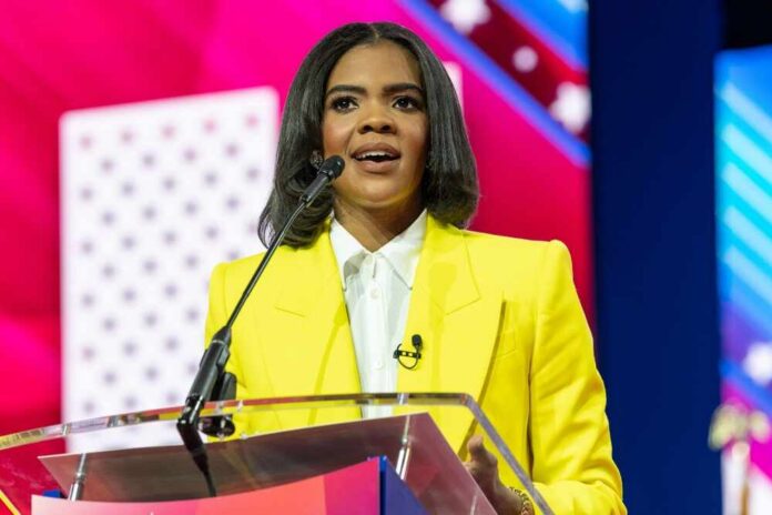 A woman in a bright yellow suit speaking at a podium during a conference