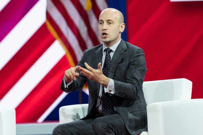 Stephen,Miller,,America,First,Legal,Speaks,On,The,3rd,Day A man in a suit speaking passionately at a conference panel