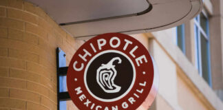 Chipotle Mexican Grill sign mounted on a brick wall