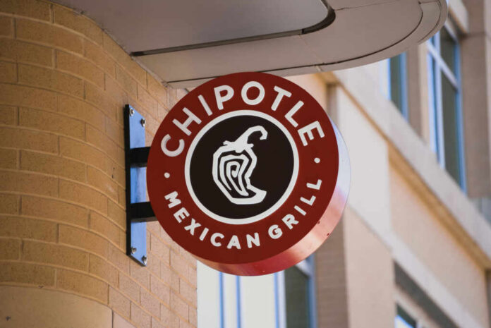 Chipotle Mexican Grill sign mounted on a brick wall