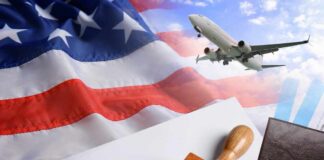 Visa stamp and travel documents on an American flag background with an airplane in the sky