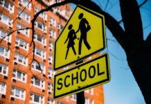School zone sign indicating pedestrian safety for children