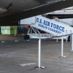U.S. Air Force boarding stairs next to a military aircraft in an airport hangar