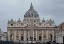 Ancient Church Forced Rome to Draw the Line St. Peters Basilica in Vatican City with a cloudy sky and a large obelisk in the foreground